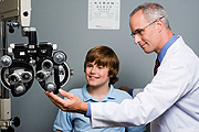 Teenage boy having his eye check up